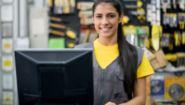 Woman working on the checkout at a hardware store 